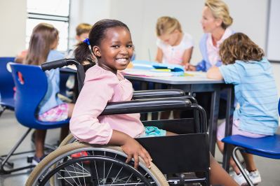 Girl in wheelchair in classroom